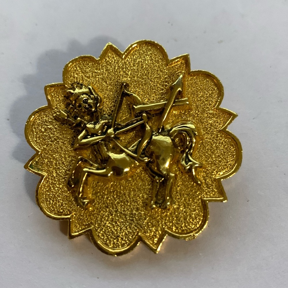 Gold tone Sagittarius brooch